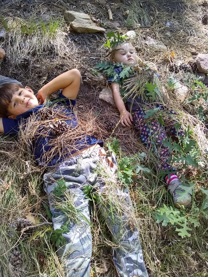 children camouflaging with nature